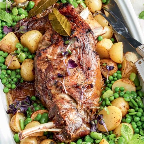 Slow-cooked lamb shoulder with peas, mint, potatoes and broad beans